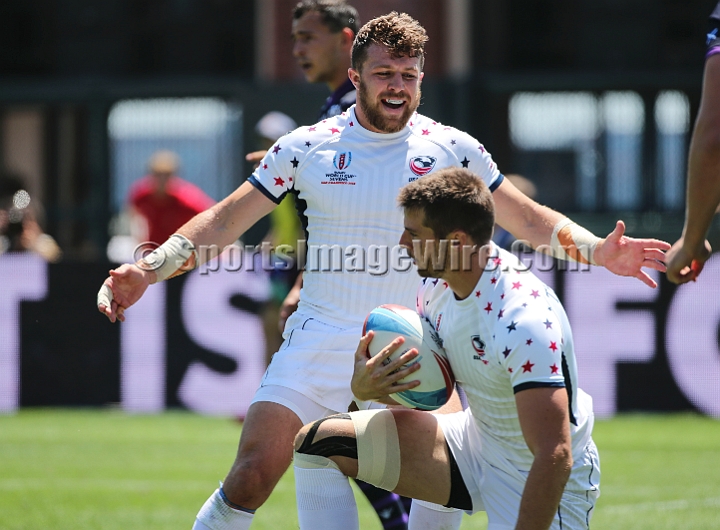2018RugbySevensSun-03.JPG - United States player Stephen Tomasin reacts to a try by Brett Thompson in the men's championship 5/8 place match against Scotland in the 2018 Rugby World Cup Sevens, Sunday, July 22, 2018, at AT&T Park, San Francisco. USA defeated Scotland 28-0. (Spencer Allen/IOS via AP)